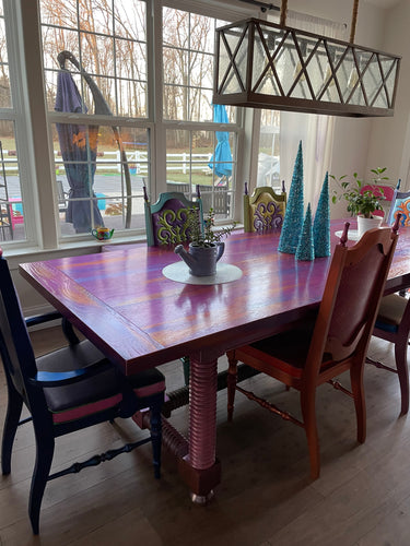 Hand painted dining table with painted leather chairs